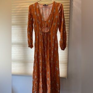 Orange maxi dress with high slits and beautiful chest detail